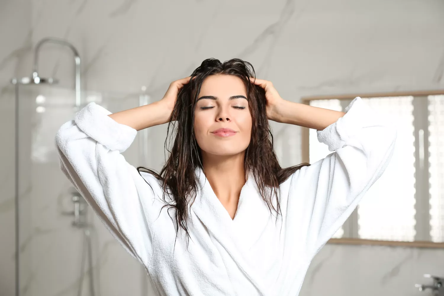 Woman Massages Her Head After Shower