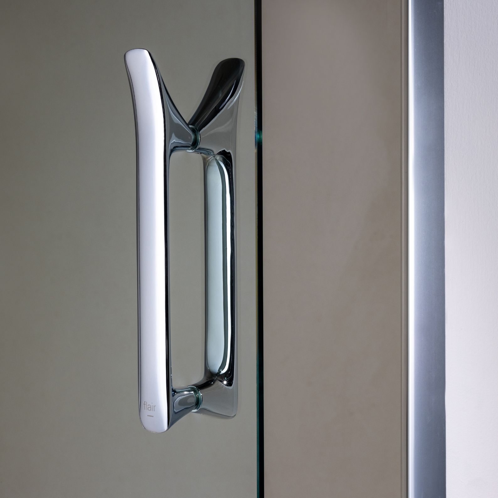 Signature handle design - a precisely crafted, solid, chrome plated handle featuring an integrated robe hook.